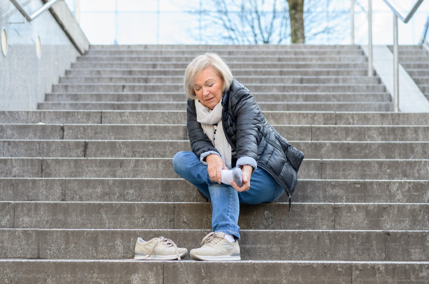A person who has fallen on outdoor steps
